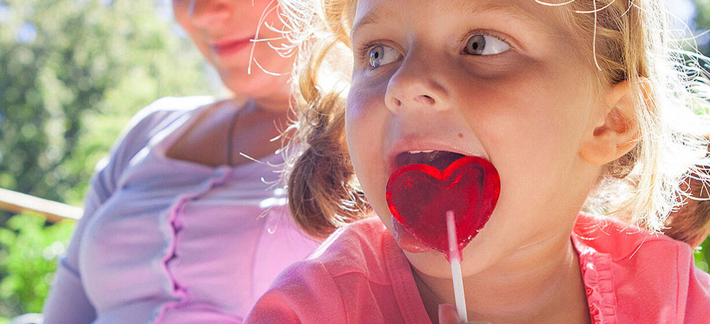 little girl with a lollipop