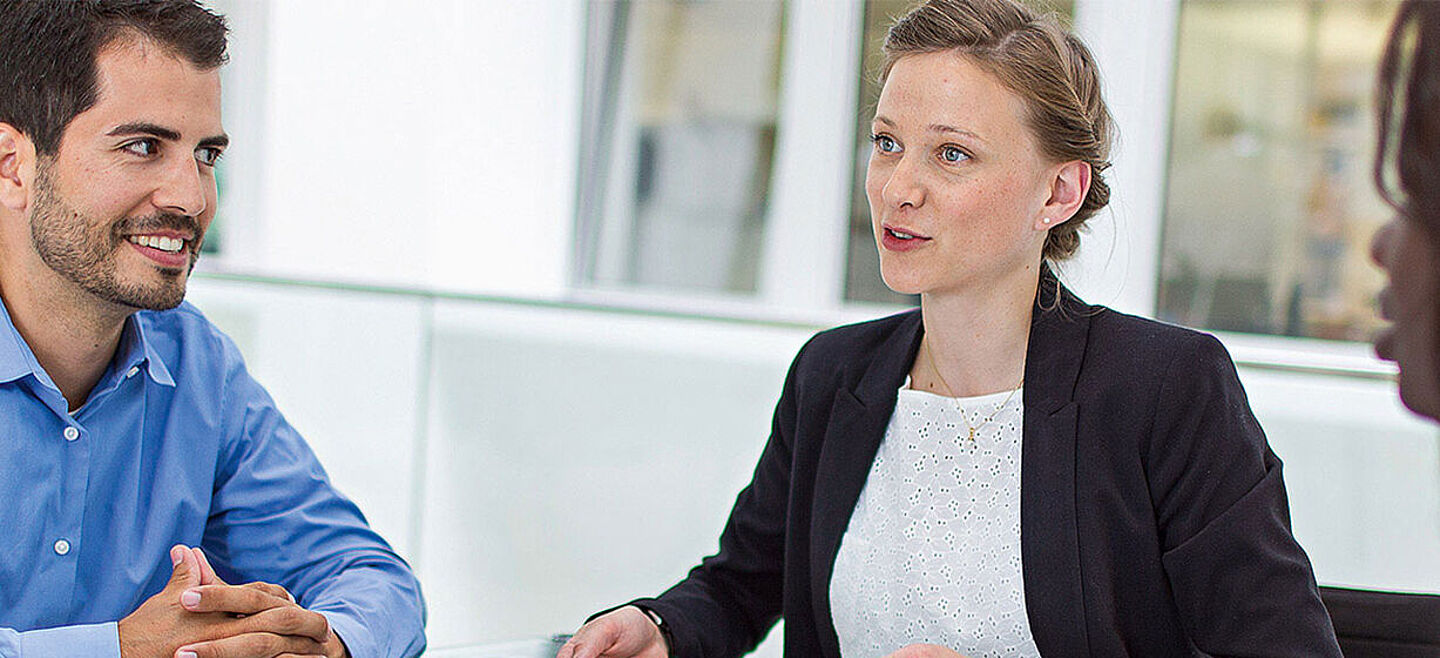 four people in a meeting