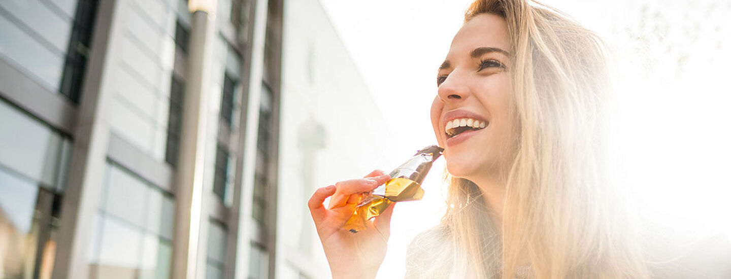 girl eating a cereal bar