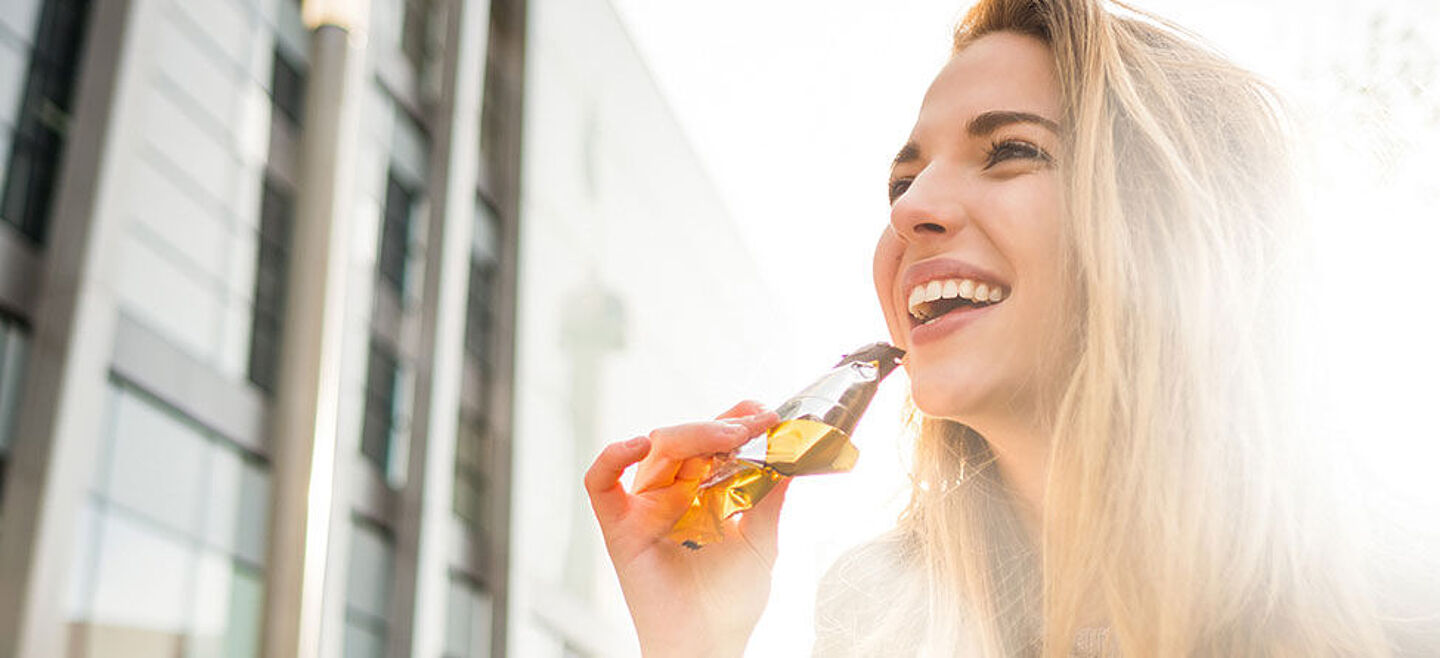 girl eating a cereal bar