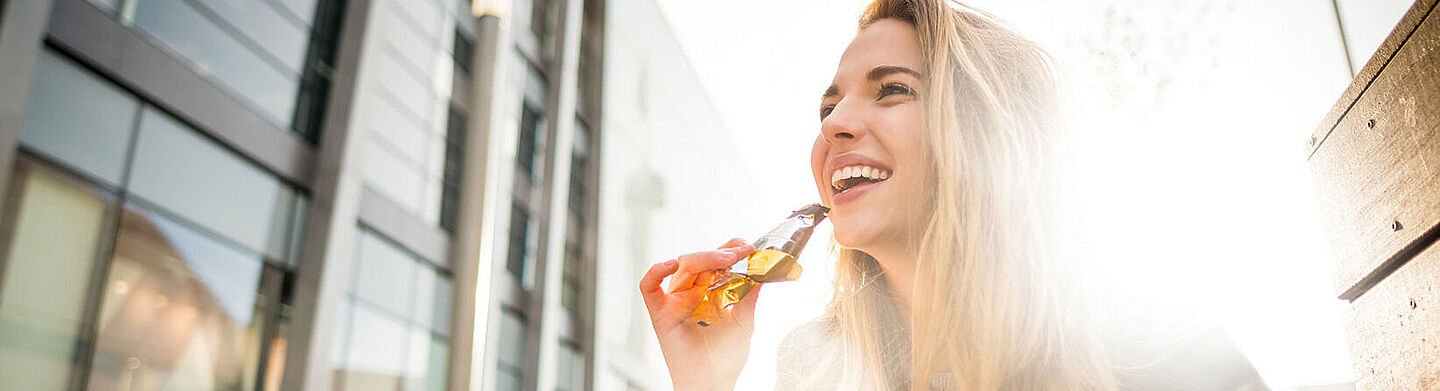 girl eating a cereal bar