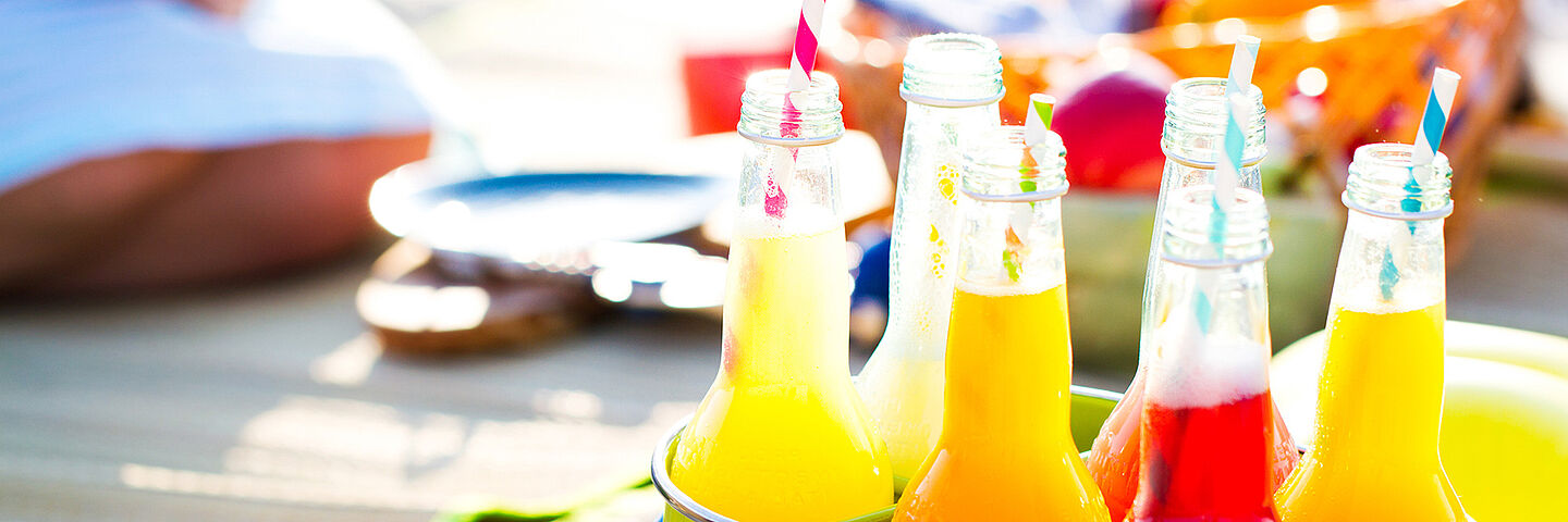 bottles with yellow, orange and red liquid