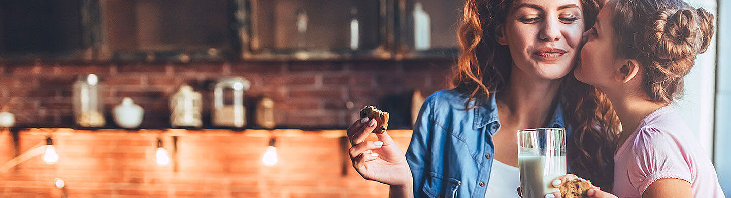 girl and woman eating biscuits