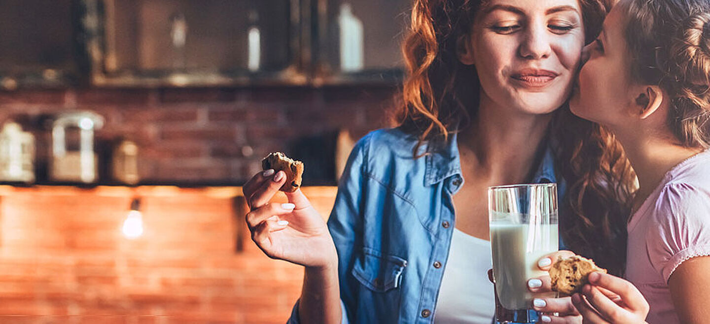 girl and woman eating biscuits