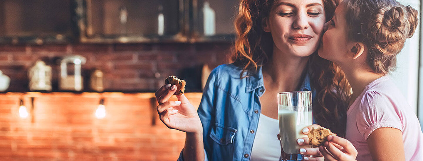 girl and woman eating biscuits