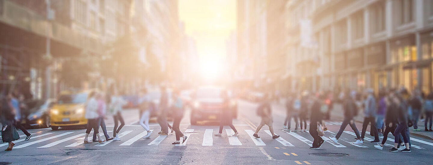 people on the street in the middle of a big city