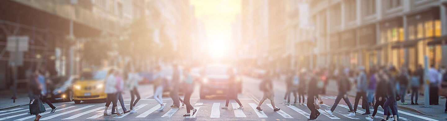 people on the street in the middle of a big city