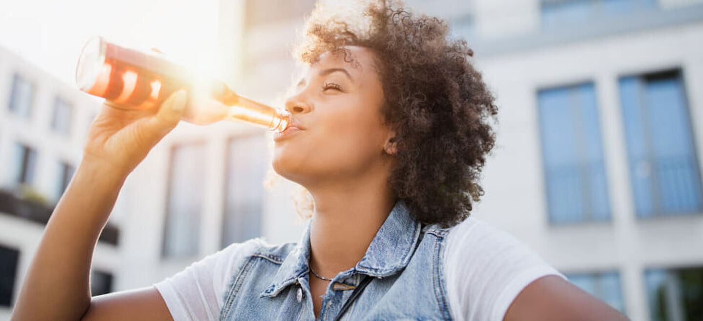 girl drinking carbonated soft drinks