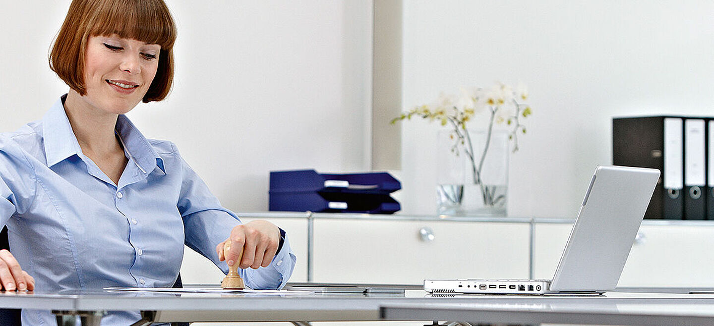 women working on a desk