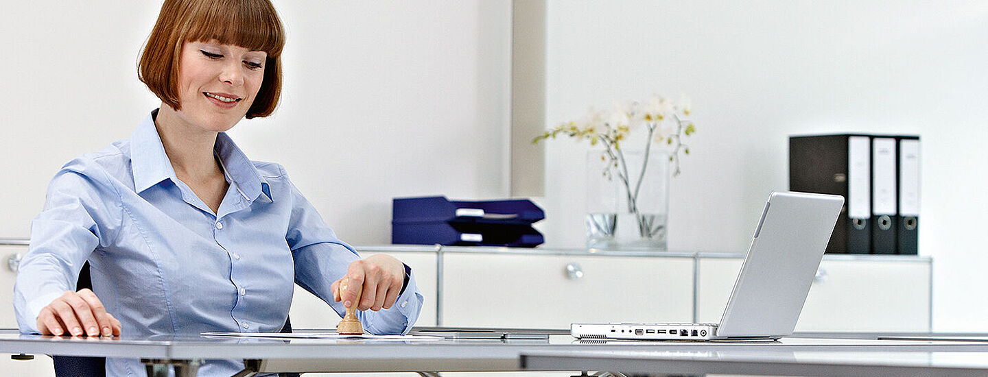 women working on a desk