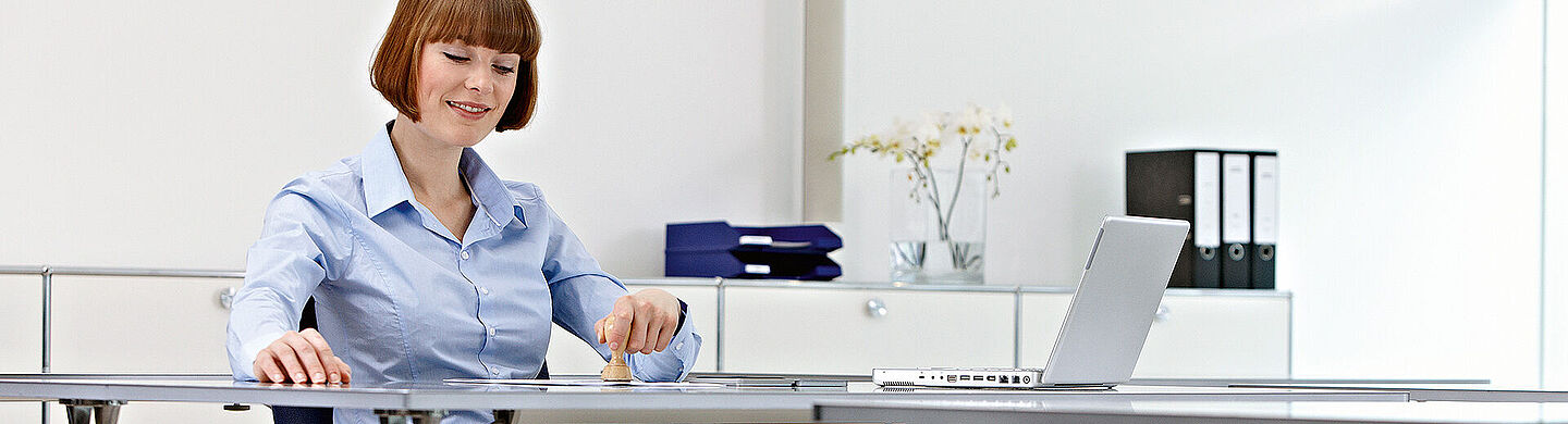 women working on a desk