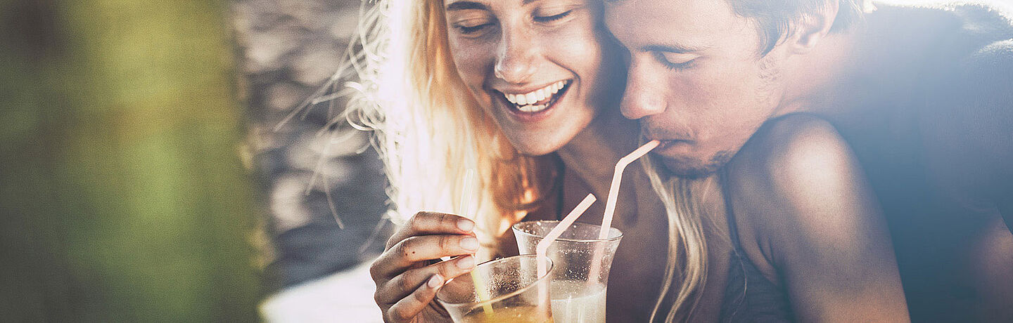 Man and woman with soft drinks