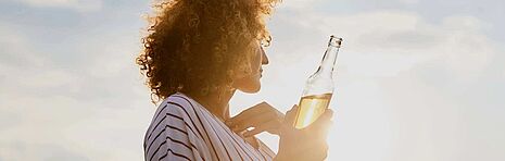 Woman with a bottle in her hand