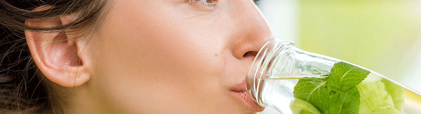 woman drinking water with mint