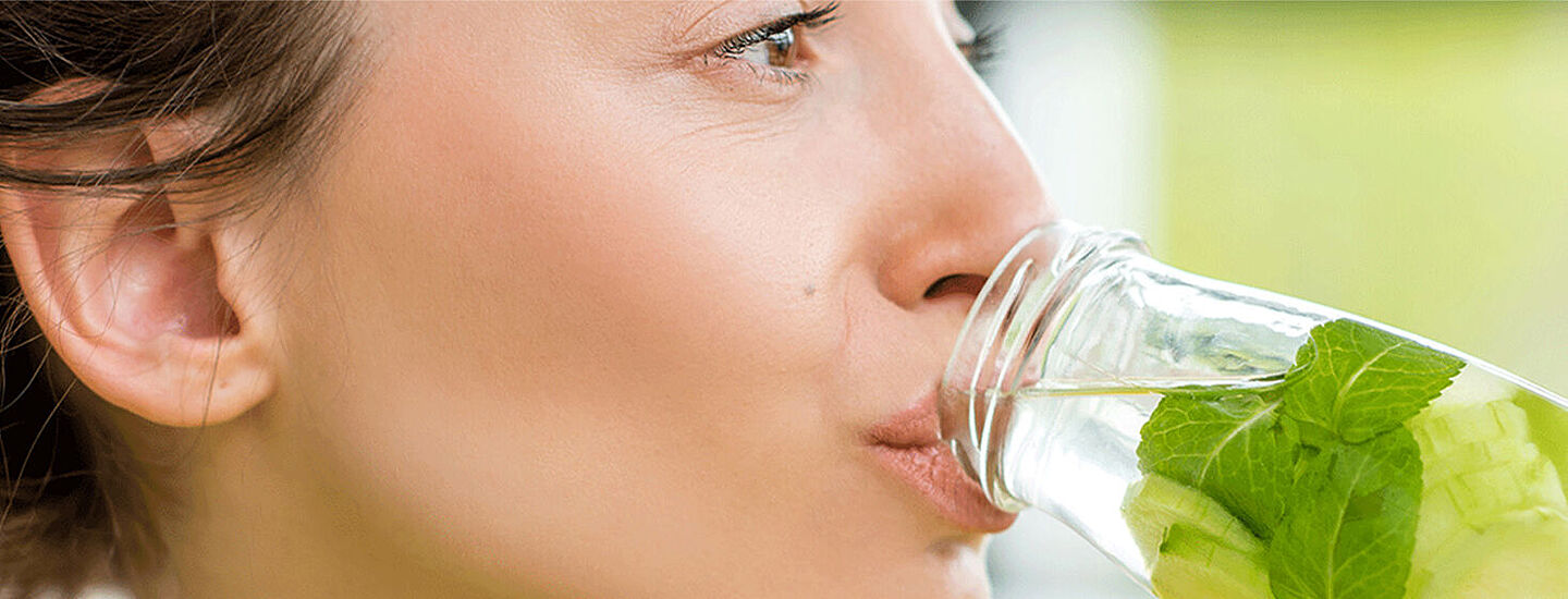 woman drinking water with mint