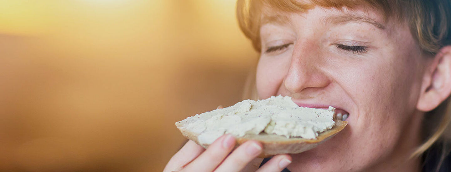 girl tasting a bit of food