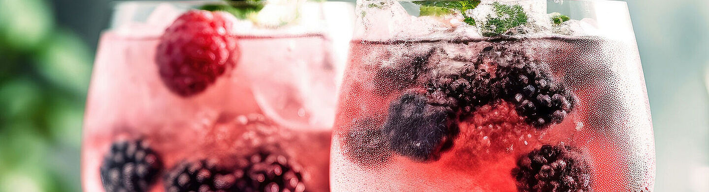 two glasses with water and red berries