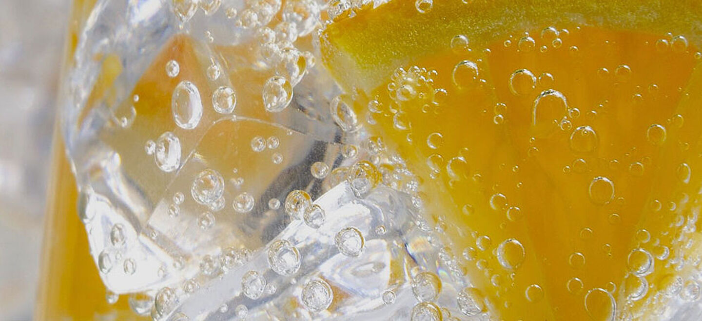 Glass with water and slice of lemon