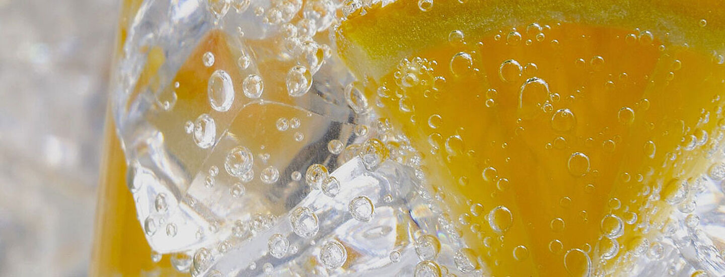 Glass with water and slice of lemon