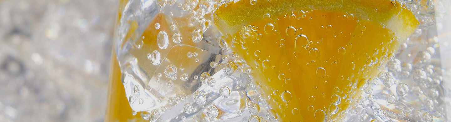 Glass with water and slice of lemon