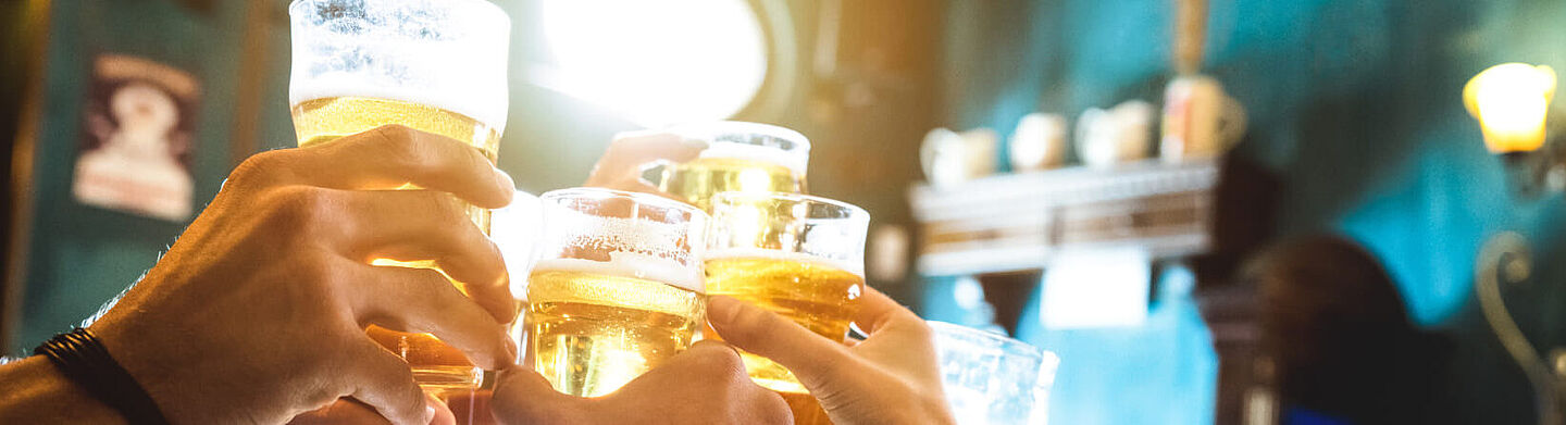 people toasting with beer