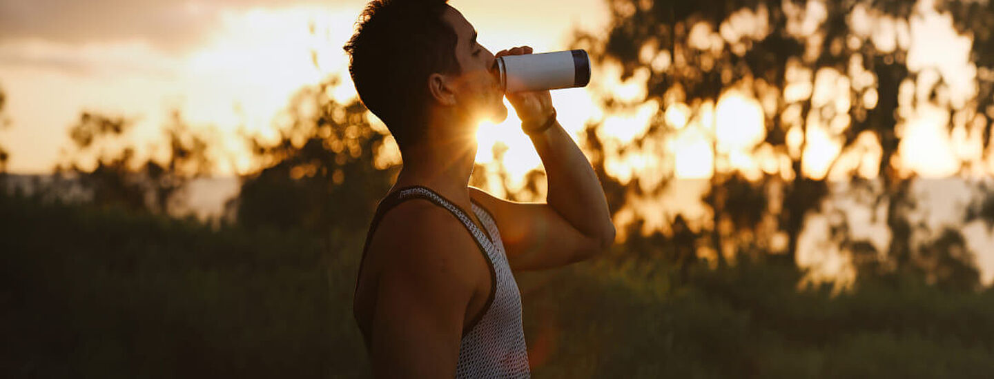 men drinking energy drink