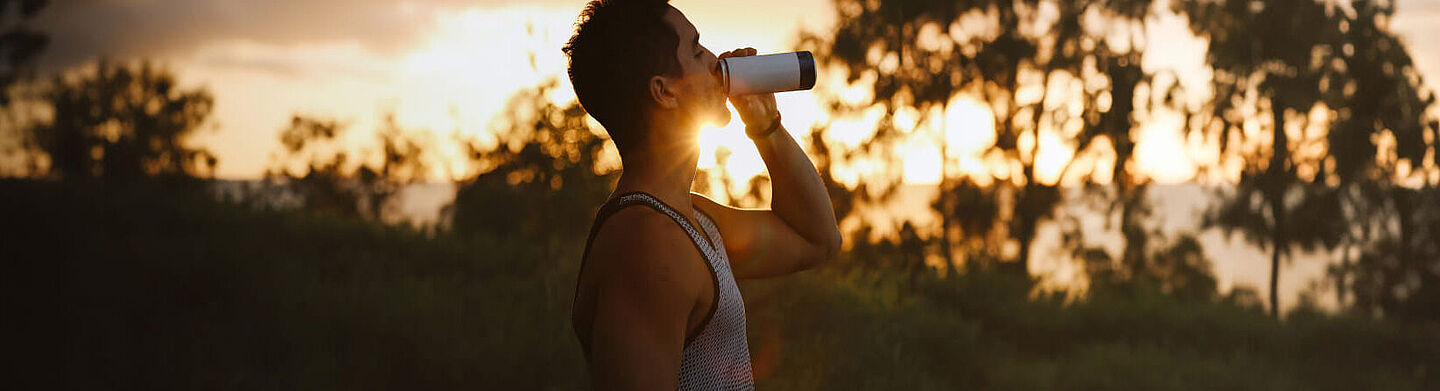 men drinking energy drink