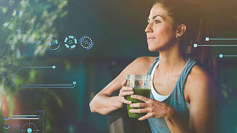 person and green juice