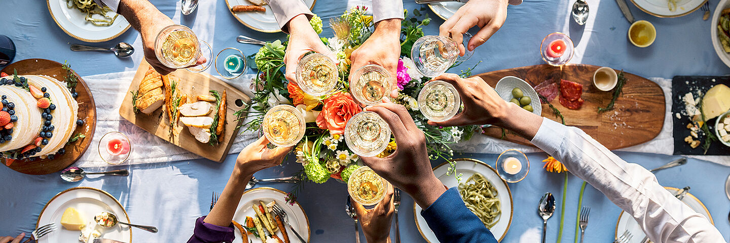 table with food and with people cheering