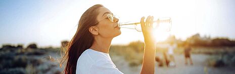 Woman drinking from a bottle